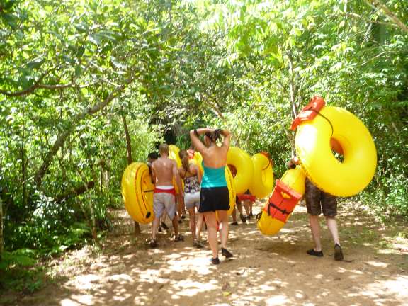Belize cave tubing2 carrying tubes through the jungle