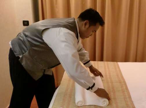 roll ends of towel to middle