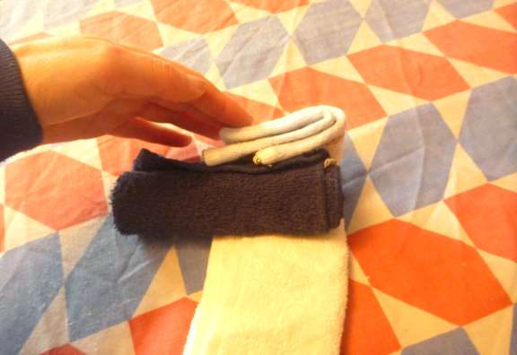 making towel cake with candle