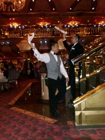 Dining - golden dining room cruise ship waiters singing and dancing