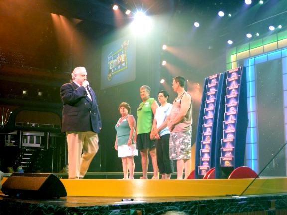 contestants line up to pick their Monopoly cards