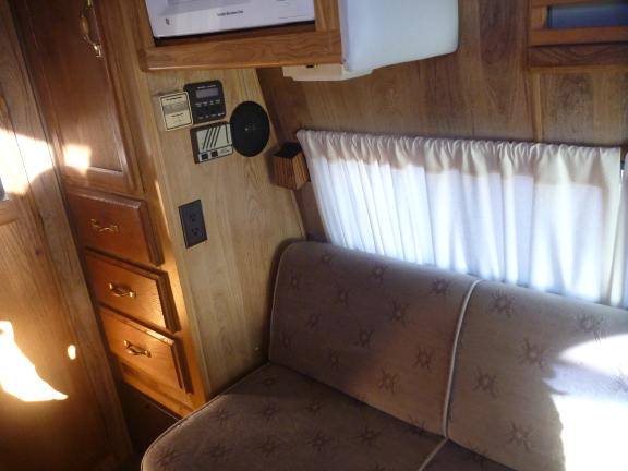 couch in a camper van converts to a bed