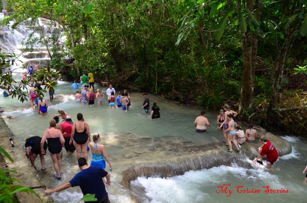 crowds of people climbing Dunns River Falls