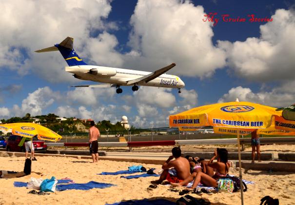 the beach where the airplanes fly just overhead