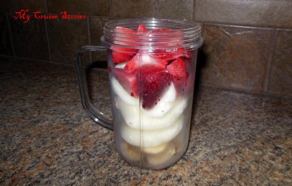 making a strawberry milkshake smoothie