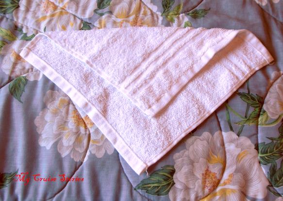folding a washcloth into a unicorn tail