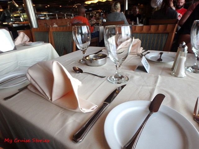 dining table set with fancy folded napkings