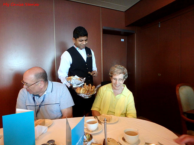 waiter serves afternoon tea