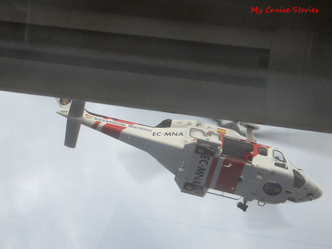 looking up at helicopter from cruise ship balcony