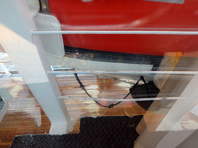view under a lifeboat to the deck below