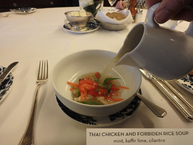 pouring broth into soup